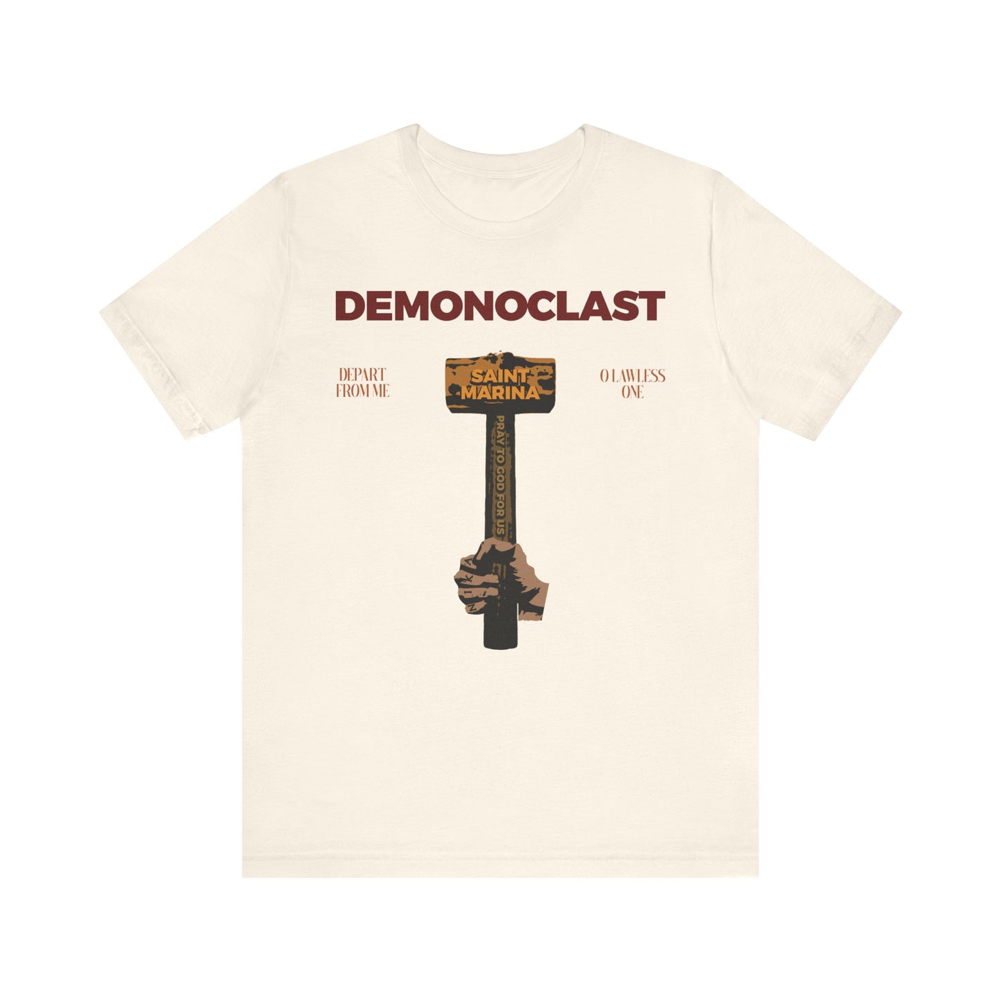 Natural tee featuring DEMONOCLAST text and St. Marina’s hammer, inspired by martyrdom and unseen warfare. Lightweight cotton unisex fit. Christ Conquers (NIKA Fist) design.