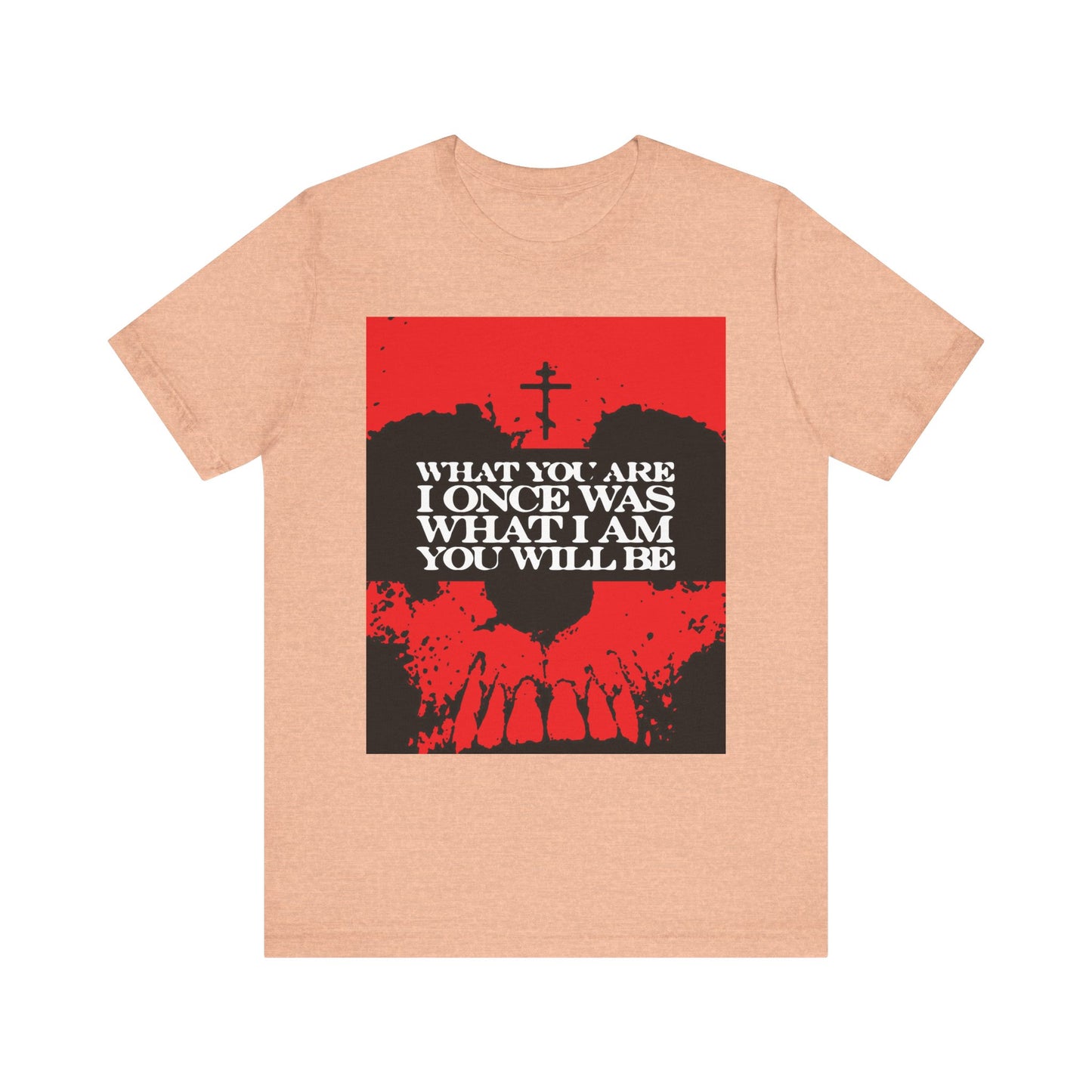 Heather peach unisex lightweight cotton tee featuring a red and black skull graphic with white text: What You Are, I Once Was. What I Am, You Will Be—a memento mori design reminding us of our shared mortality.