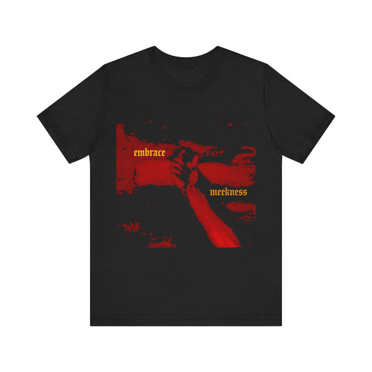 Black cotton t-shirt with haunting crucified hand of Christ artwork in red and yellow "Embrace Meekness" gothic font, inspired by the virtues of patience and The Ladder of Divine Ascent.