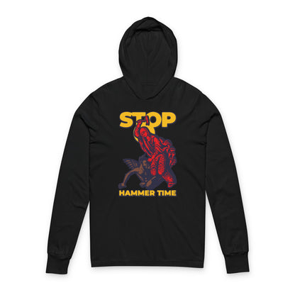 Black hoodie featuring St Marina of Antioch beating the devil with a hammer, bold “STOP HAMMER TIME” text in red, blue, and yellow—a modern Orthodox meme honoring legendary Christian courage.
