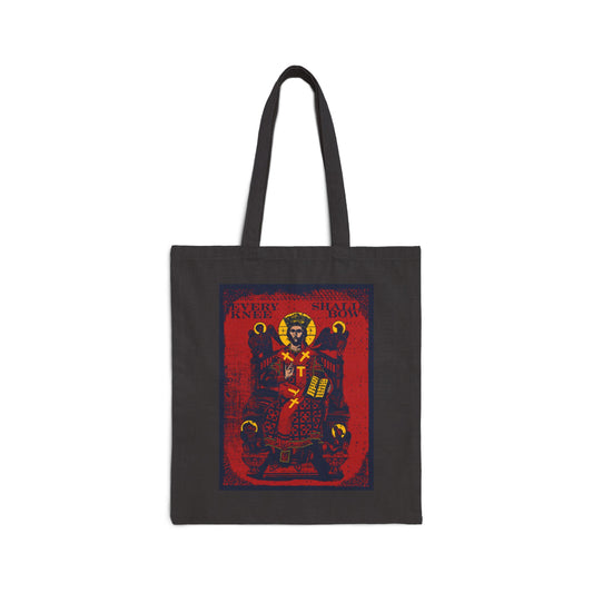 Black cotton tote bag featuring the "Every Knee Shall Bow" Christ Enthroned IconoGraphic inspired by Phil 2:8-11 & Isaiah 45:23, with Ezekiel's Chariot design on a red background.