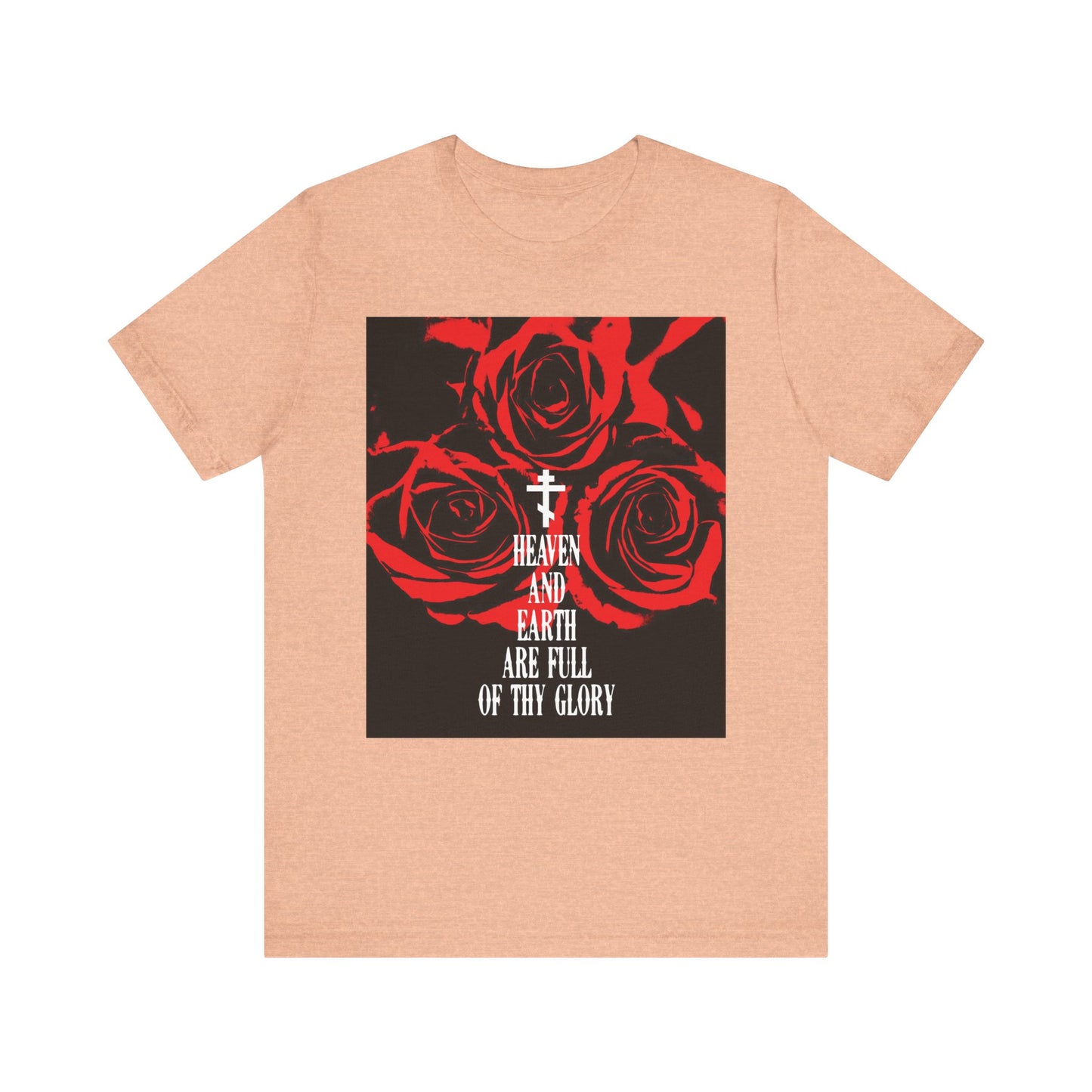 Heather peach unisex tee with red roses, a cross, and “Heaven and Earth are Full of Thy Glory”—from the Orthodox liturgical hymn—printed in Western typography on lightweight cotton.
