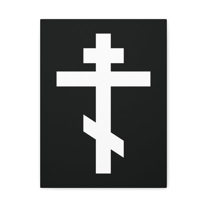 The White Orthodox Cross canvas art features a striking white cross on a black background and includes the verse: "May I never boast, except in the cross of our Lord Jesus Christ" (Gal 6:14).