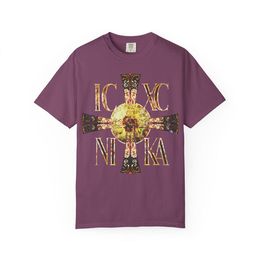 Berry-colored unisex heavyweight cotton tee featuring a Celtic-style, equal-armed cross in gold and black with ornate designs and the Greek letters IC XC NIKA on the front. Inspired by traditional Orthodox iconography, this design incorporates a bright solar texture—evoking the never-setting Sun to symbolize Christ’s victory, eternal light, and divine presence.