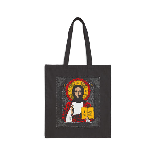 Black tote bag featuring the Christ Pantocrator Icono-Graphic with Greek text referencing "I Am the Alpha and Omega"—an ancient Orthodox Christian design inspired by Exodus 3:14.
