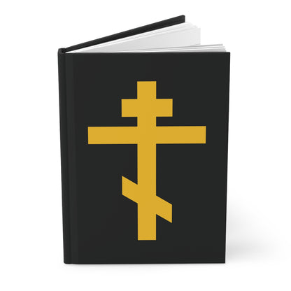 Black hardcover journal featuring a yellow Orthodox Cross on a black background, titled "Precious and Life-Giving Weapon of Unseen Warfare | Scourge of Demons | Orthodox Hardcover Journal." Inspired by Galatians 2:20.