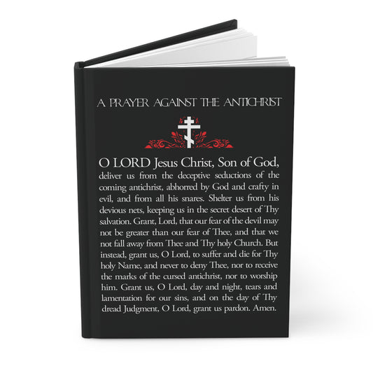 A black journal titled "Prayer Against the Antichrist By Elder Anatoly the Younger of Optina" features a white cross with red accents and presents an Orthodox Christian theme inspired by the Book of Revelation.