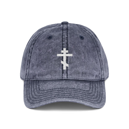 Navy baseball cap with a minimalist white Orthodox TriBar Cross embroidered on the front, symbolizing Christ’s crucifixion. "Crucify My Ego to the Precious and Life Giving Cross"—a simple, distressed Christian statement piece.