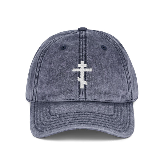 Navy baseball cap with a minimalist white Orthodox TriBar Cross embroidered on the front, symbolizing Christ’s crucifixion. "Crucify My Ego to the Precious and Life Giving Cross"—a simple, distressed Christian statement piece.