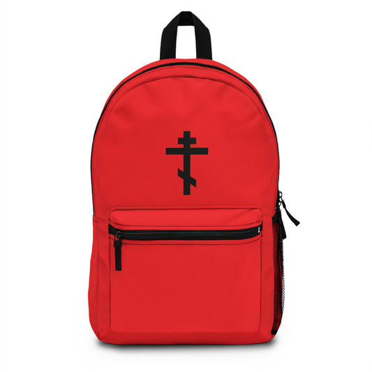 Red Orthodox Christian backpack featuring a black Orthodox cross on a red background and Galatians 6:14: “May I never boast, except in the cross of our Lord Jesus Christ.” Inspired by St. John Chrysostom.