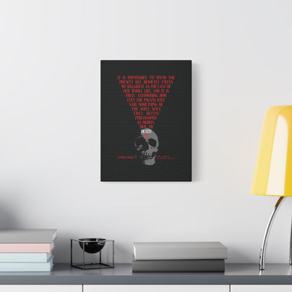 A modern desk with books, a bowl, and a yellow lamp sits beneath "The Present Day As the Last Day of Our Life" Orthodox Canvas Wall Art—featuring a skull and red cross in the memento mori tradition.