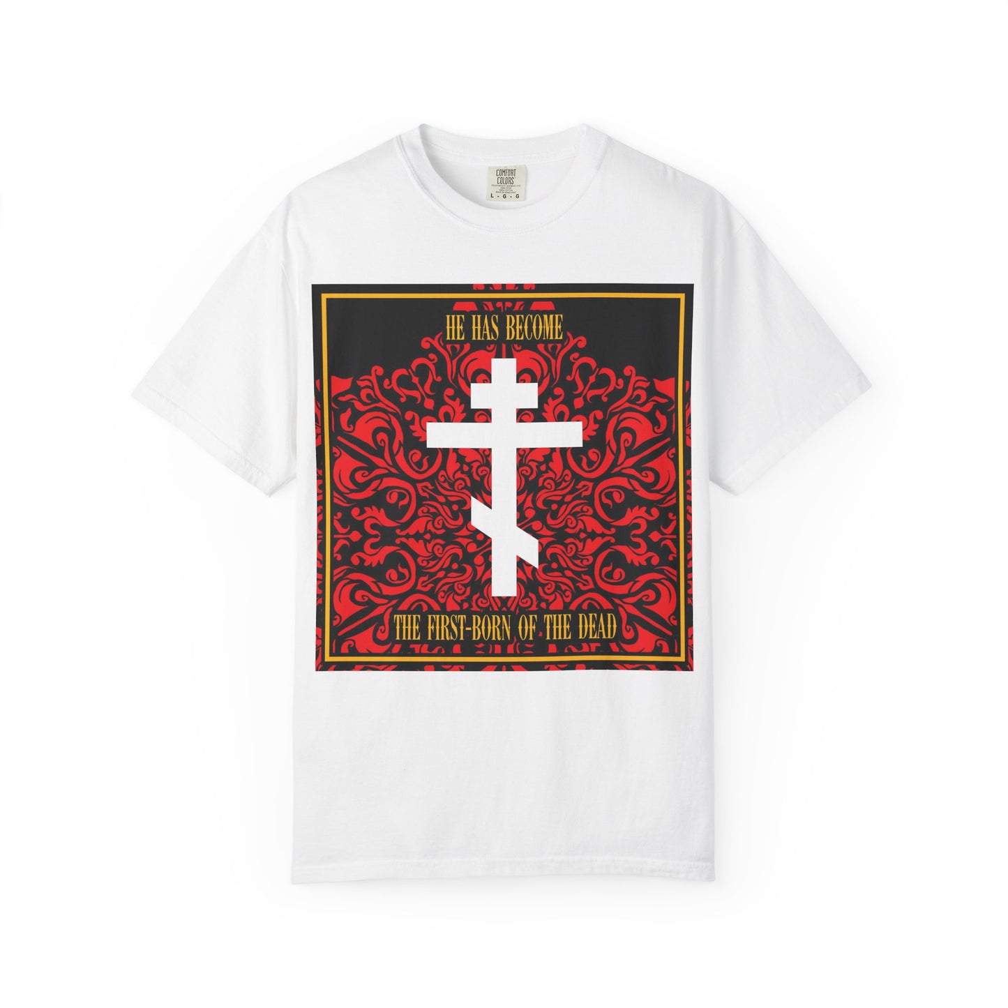 Show your faith in style with the He Has Become the First-Born of the Dead | White Orthodox Cross on Red Floral Texture | Heavyweight Cotton Unisex Tee. This white heavyweight cotton unisex shirt features an ornate red, black, and gold Orthodox cross design and is perfect for anyone looking for a bold Bible verse shirt.