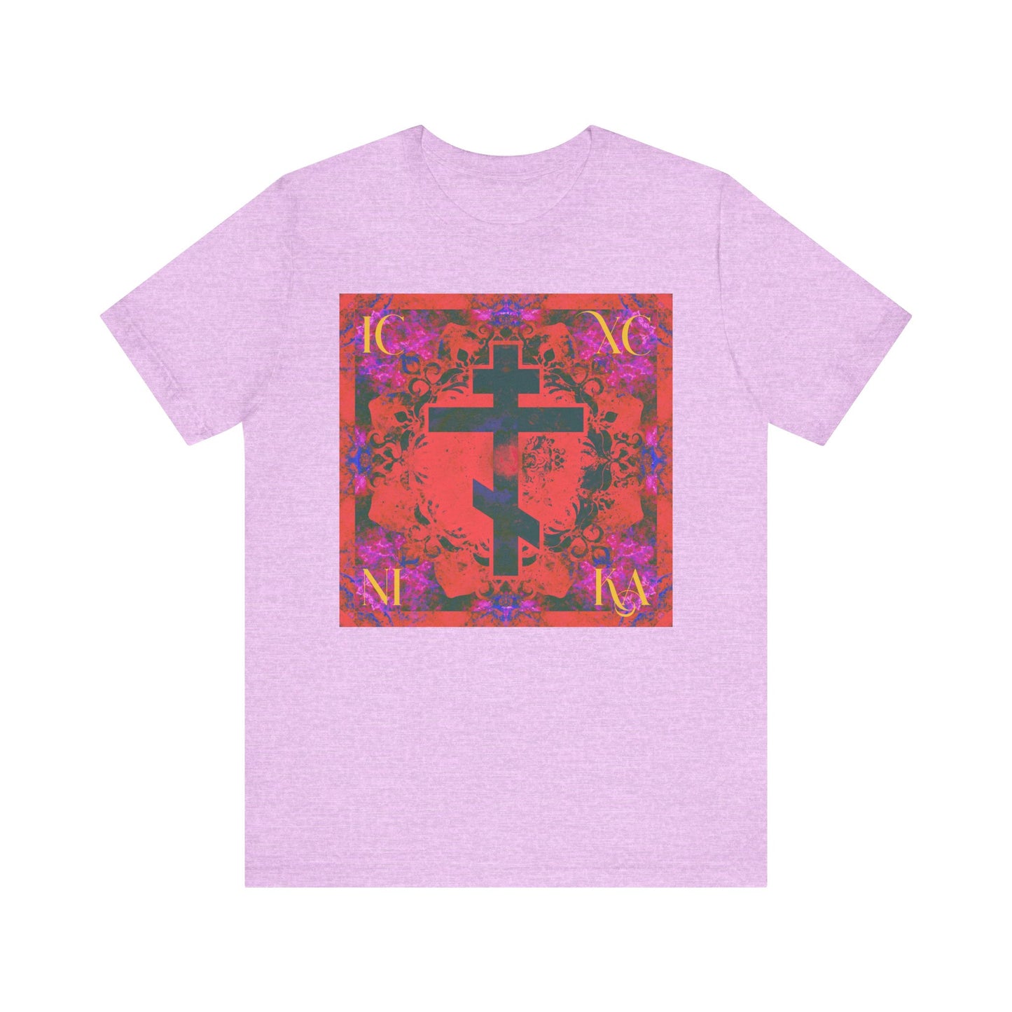 Heather Prism Lilac t-shirt featuring a colorful orange and magenta Cross within a red, floral patterned square. The ICXC NIKA inscription appears, symbolizing the Saviour’s sufferings and reflecting the faith of Orthodox Christian saints like St. John of Kronstadt.