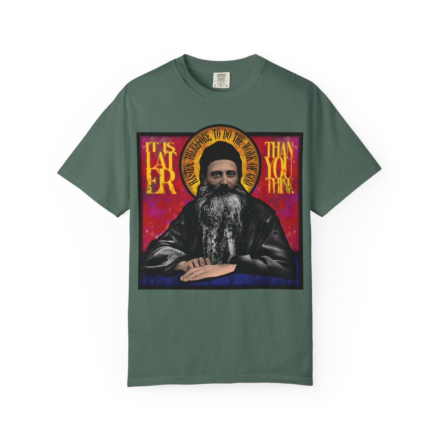 The "It Is Later Than You Think" heavyweight cotton unisex T-shirt features Fr. Seraphim Rose in a stained glass design, reflecting on salvation and the urgency of seeking the Kingdom of Heaven.