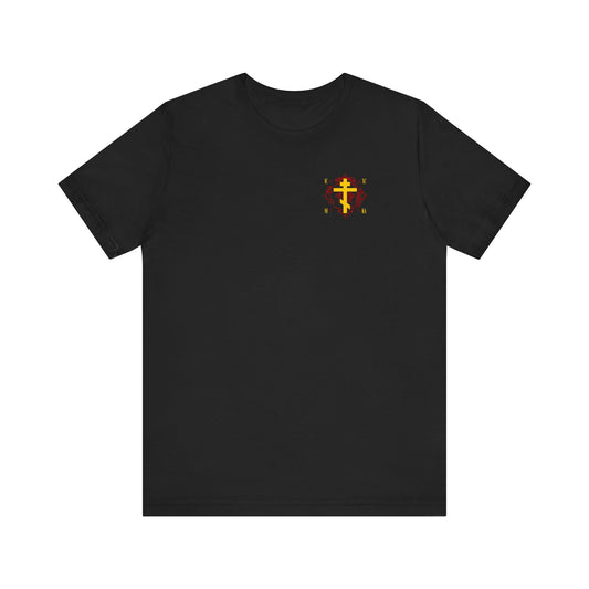 Black lightweight cotton unisex tee featuring a small ICXC NIKA yellow Orthodox Cross on an ornate red background on the left chest. Inspired by the teachings of St Kosmas Aitolos.