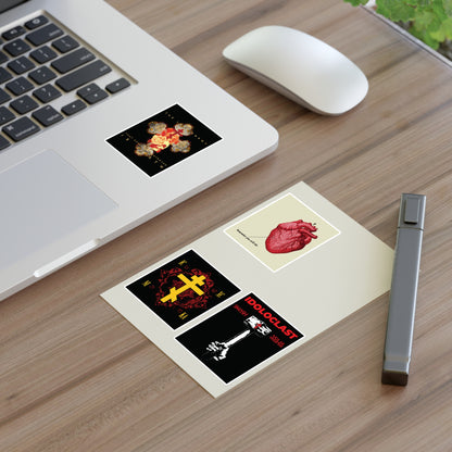 Bestseller Mix No. 2 Four Orthodox Stickers on a notepad by a laptop and pen on a wooden desk.