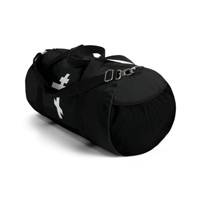 White Orthodox Cross gym duffel bag featuring the quote "May I never boast, except in the cross of our Lord Jesus Christ" (Gal 6:14), inspired by Orthodox tradition, with adjustable shoulder strap. Shown on a white background.