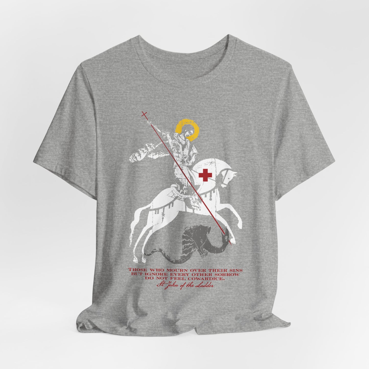 Lightweight cotton unisex tee in gray, featuring an iconographic illustration of St George slaying the dragon, a bold red cross, and text beneath—capturing the Orthodox Christian spirit of St John Climacus and embodying the somber determination described in “Those Who Mourn Over Their Sins.”.