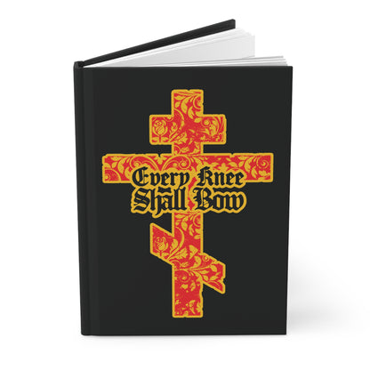 A black Christian journal titled "Every Knee Shall Bow" (Isaiah 45:22-24, Phil 2:7-11) features a gold and red floral Orthodox cross with gothic lettering on the cover.