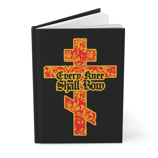 A black Christian journal titled "Every Knee Shall Bow" (Isaiah 45:22-24, Phil 2:7-11) features a gold and red floral Orthodox cross with gothic lettering on the cover.