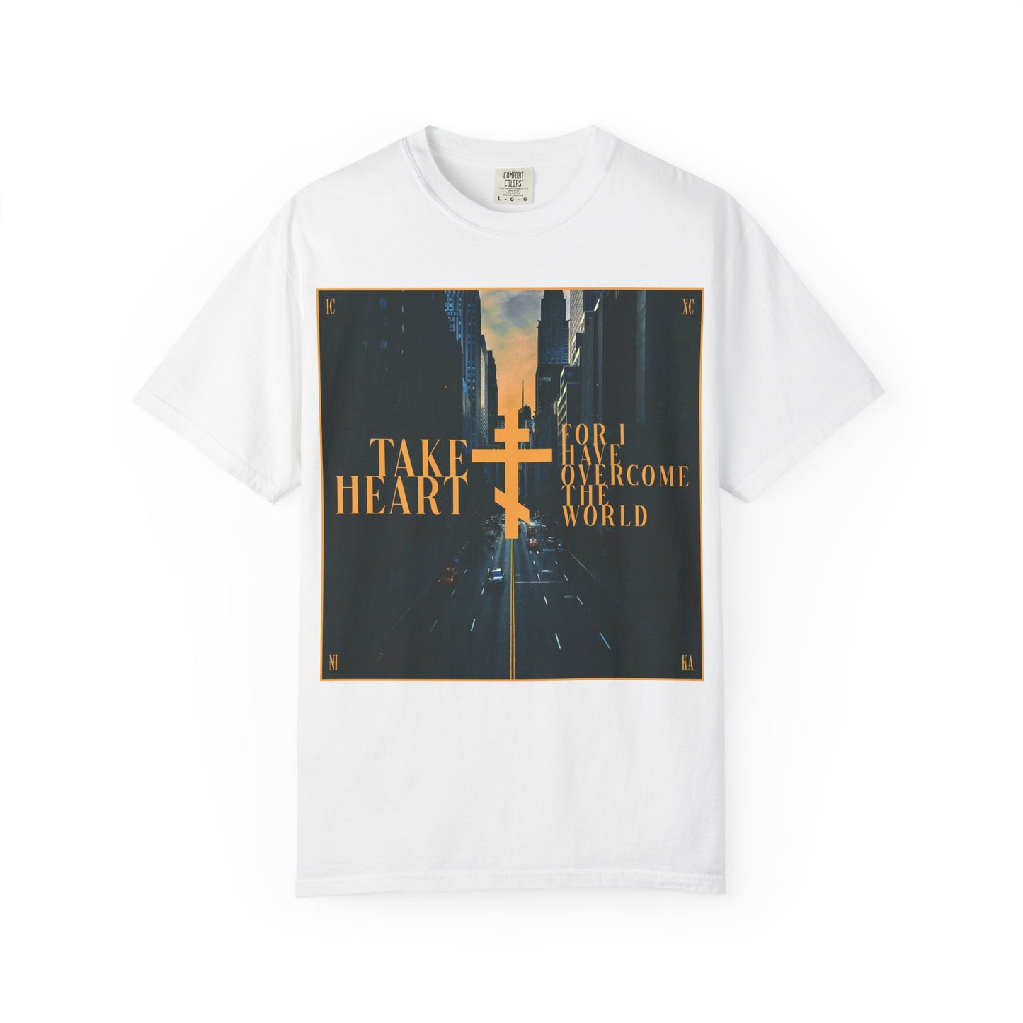 White "Take Heart, For I Have Overcome the World" heavyweight cotton unisex tee featuring a modern city street scene design inspired by John 16:33.