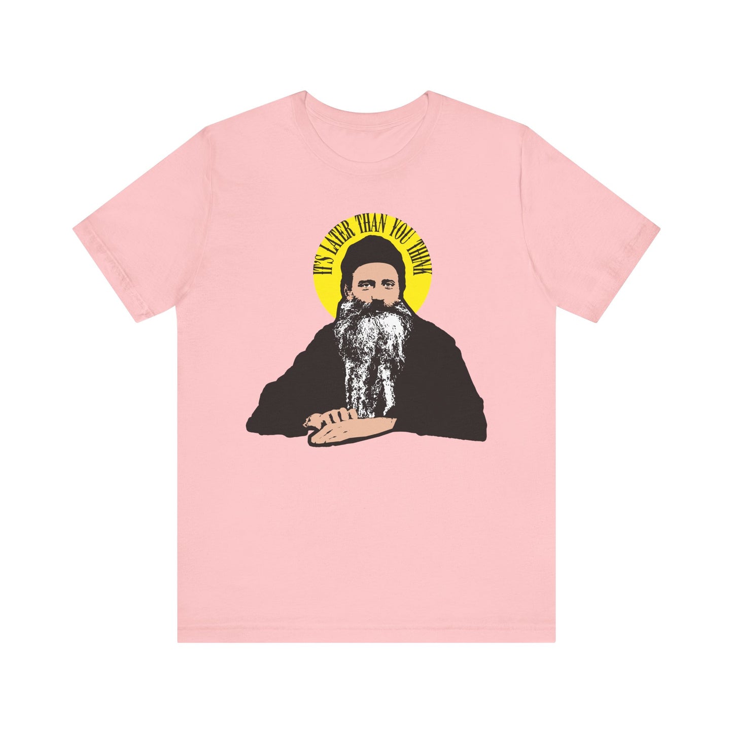 Pink tee featuring “It’s Later Than You Think” in a yellow halo, inspired by St. Seraphim Rose; lightweight cotton unisex shirt with modern Orthodox saint design.