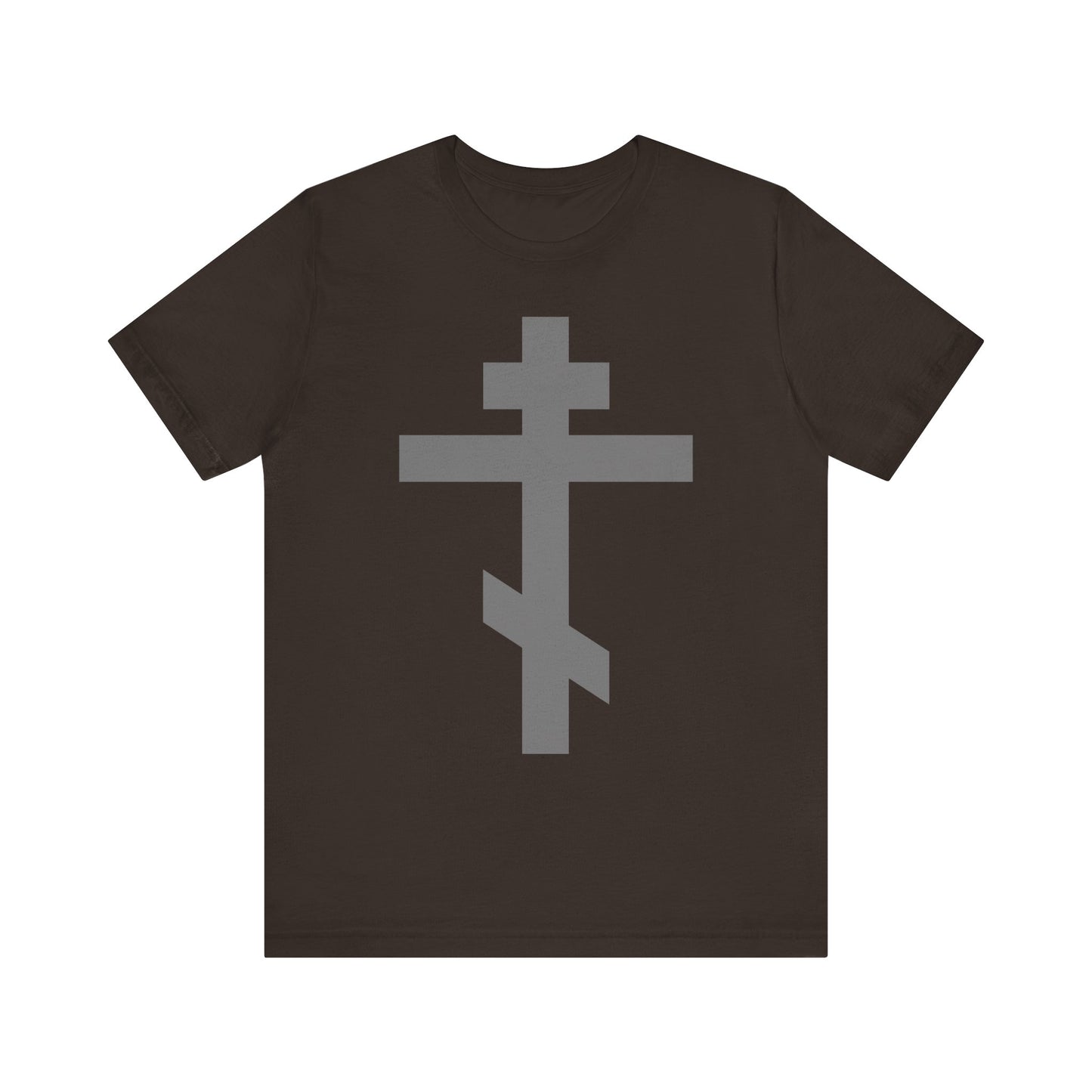 Brown t-shirt featuring a large, stylized light gray Orthodox tribar cross on the front, inspired by "Preserve Thy People By Thy Cross, O Lord" and proclaiming "Christ is King"—a lightweight unisex cotton tee reflecting the enduring strength of faith.