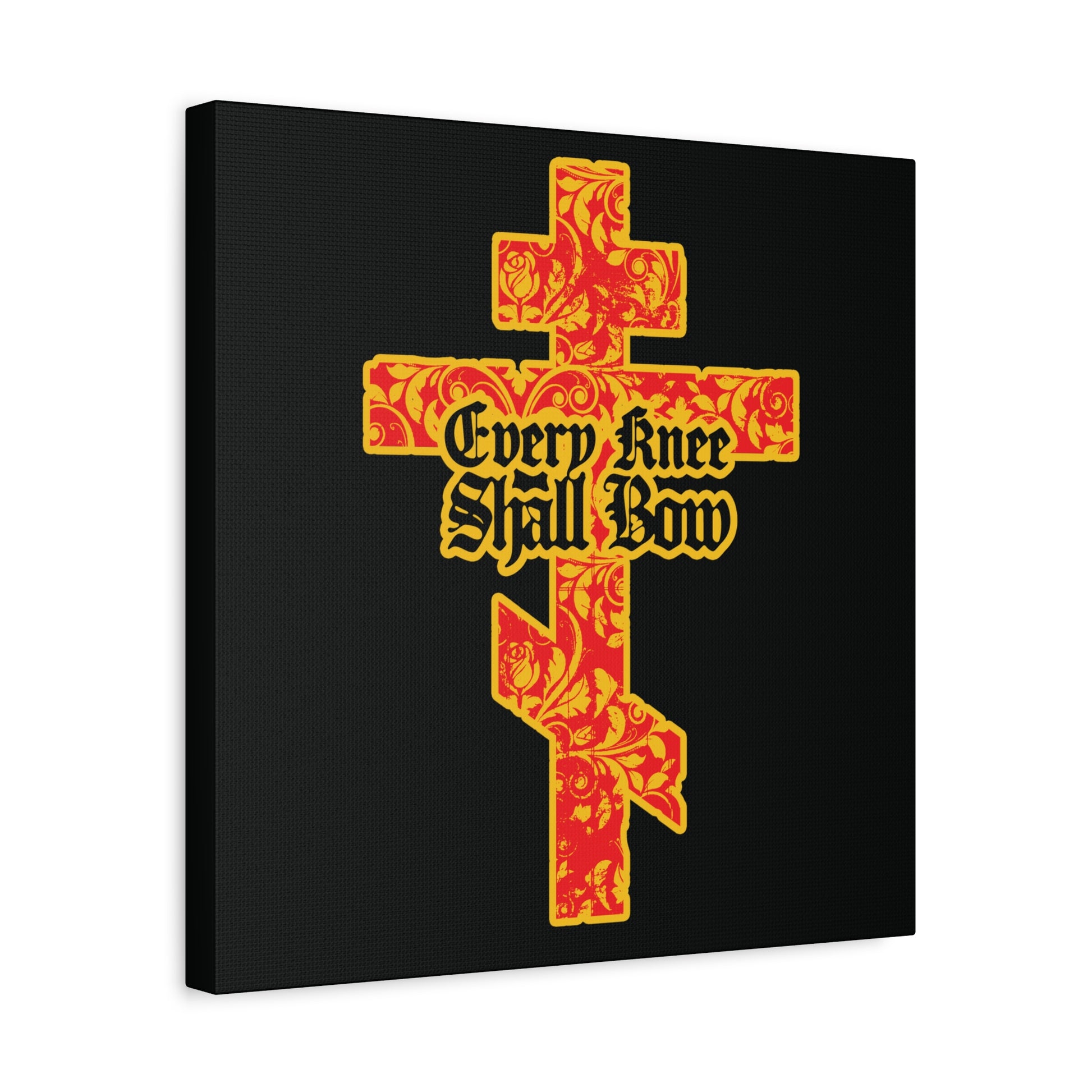 The "Every Knee Shall Bow" Christian wall art features a gold and red floral-textured Orthodox cross with gothic lettering of Isaiah 45:22-24 and Phil 2:7-11 on a black background.