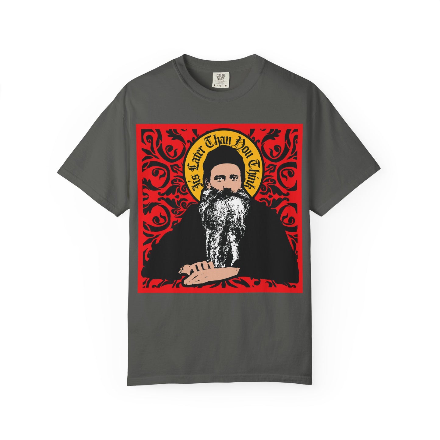 Pepper-colored heavyweight cotton unisex tee featuring a striking iconographic-style graphic of Saint Seraphim Rose of Platina inside an ornate red and yellow frame, with stylized text above—perfect for those interested in Orthodoxy and Orthodox Christian themes. Product name: "It's Later Than You Think | Red Ornate Design.