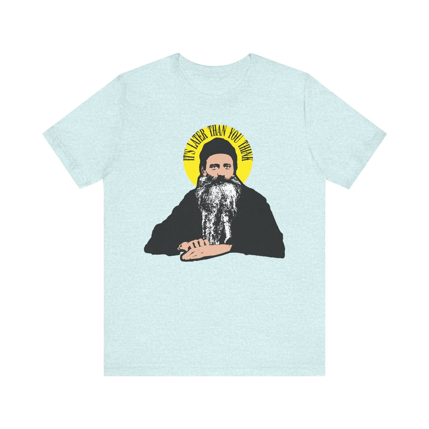 Heather Prism Ice Blue unisex cotton tee featuring the quote "It’s later than you think" in a yellow halo, inspired by St. Seraphim Rose—a modern American Orthodox saint.