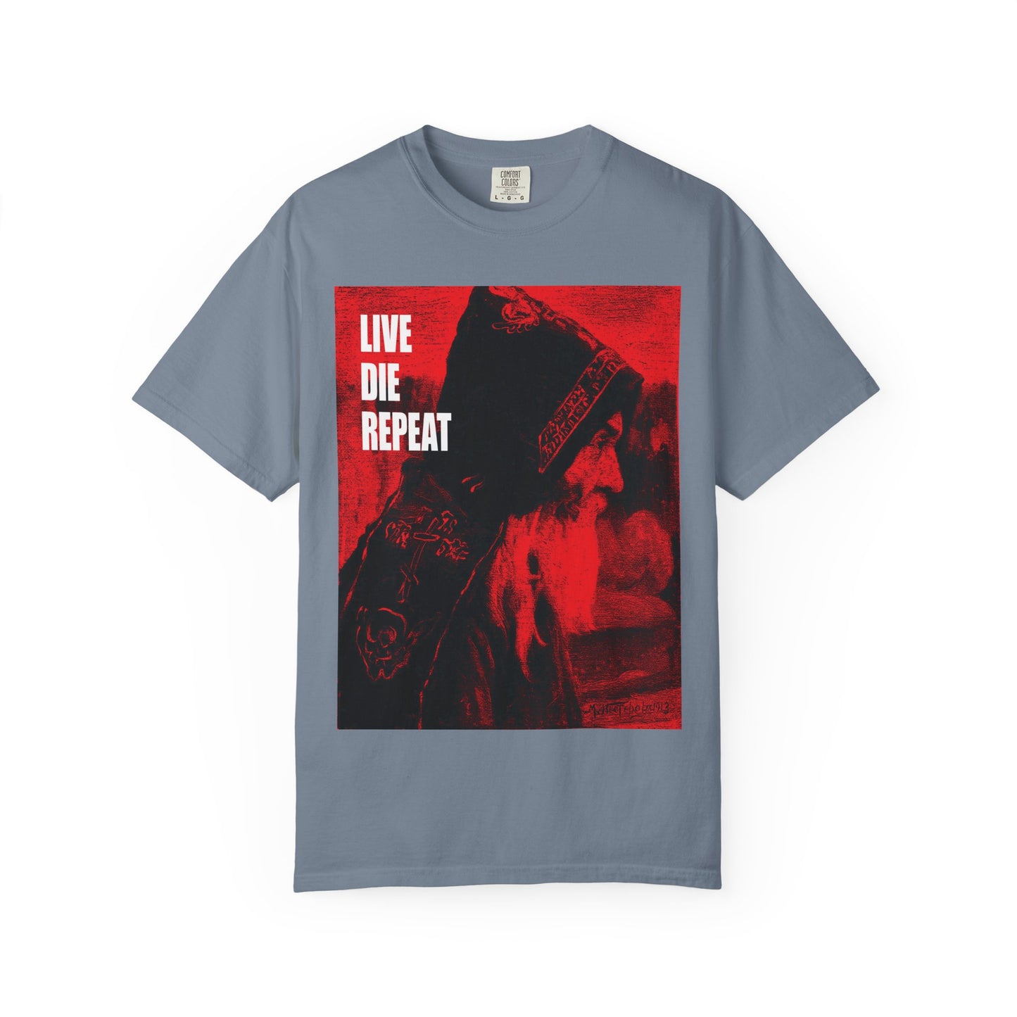 Blue Jean unisex tee featuring Mikhail Nesterov’s Orthodox Monk art and the bold quote: “Die Every Day, You Will Live Forever”—a heavyweight cotton shirt inspiring deep reflection on ascetic life.