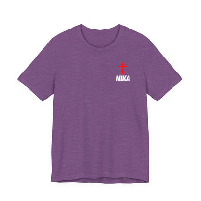 Heather Team Purple athletic t-shirt featuring an Orthodox cross and bold NIKA text—a creative mashup with a Nike-style logo—symbolizing "Jesus Christ Conquers." Small design on the upper left chest.