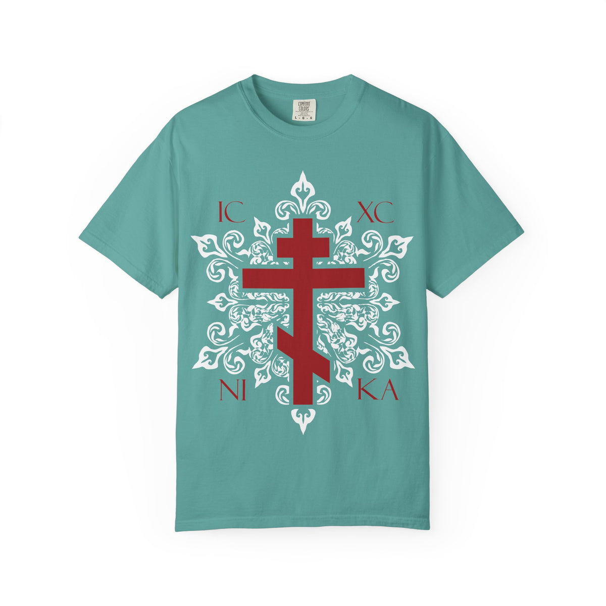 Seafoam heavyweight cotton unisex tee featuring a red ICXC / NIKA Orthodox cross set within an ornate white medieval floral design, inspired by the Adoration at the Cross and themes from the Paradise as described in the Kontakia of St. Romanos.
