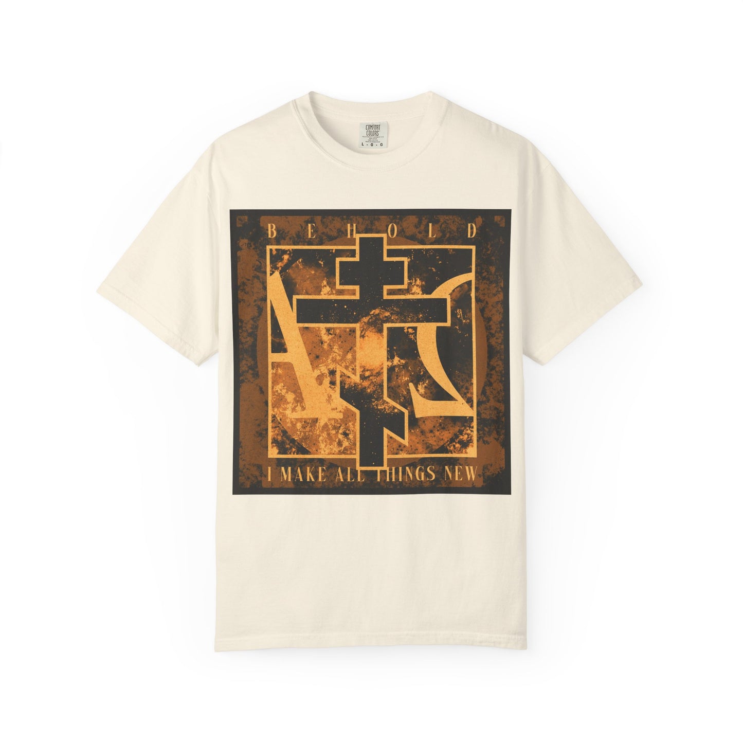 Ivory heavyweight cotton unisex t-shirt featuring a brown and orange Orthodox cross with Alpha & Omega background and the gold and black phrase "Behold, I Make All Things New" (Rev 21:5), inspired by Revelation’s promise of a new heaven and new earth.