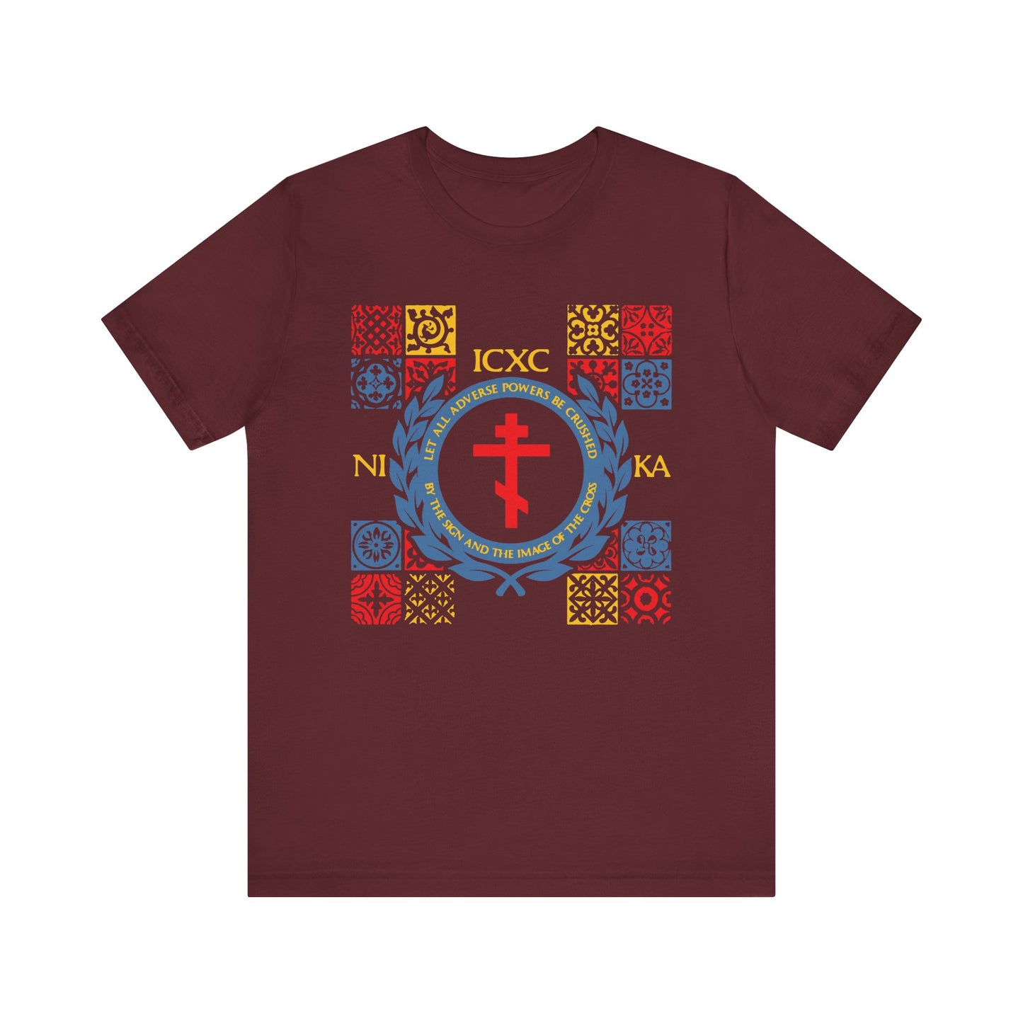 Maroon “Let All Adverse Powers Be Crushed” t-shirt featuring an ICXC NIKA medieval tile design in red, yellow, and blue—lightweight cotton unisex style inspired by Greek tradition.