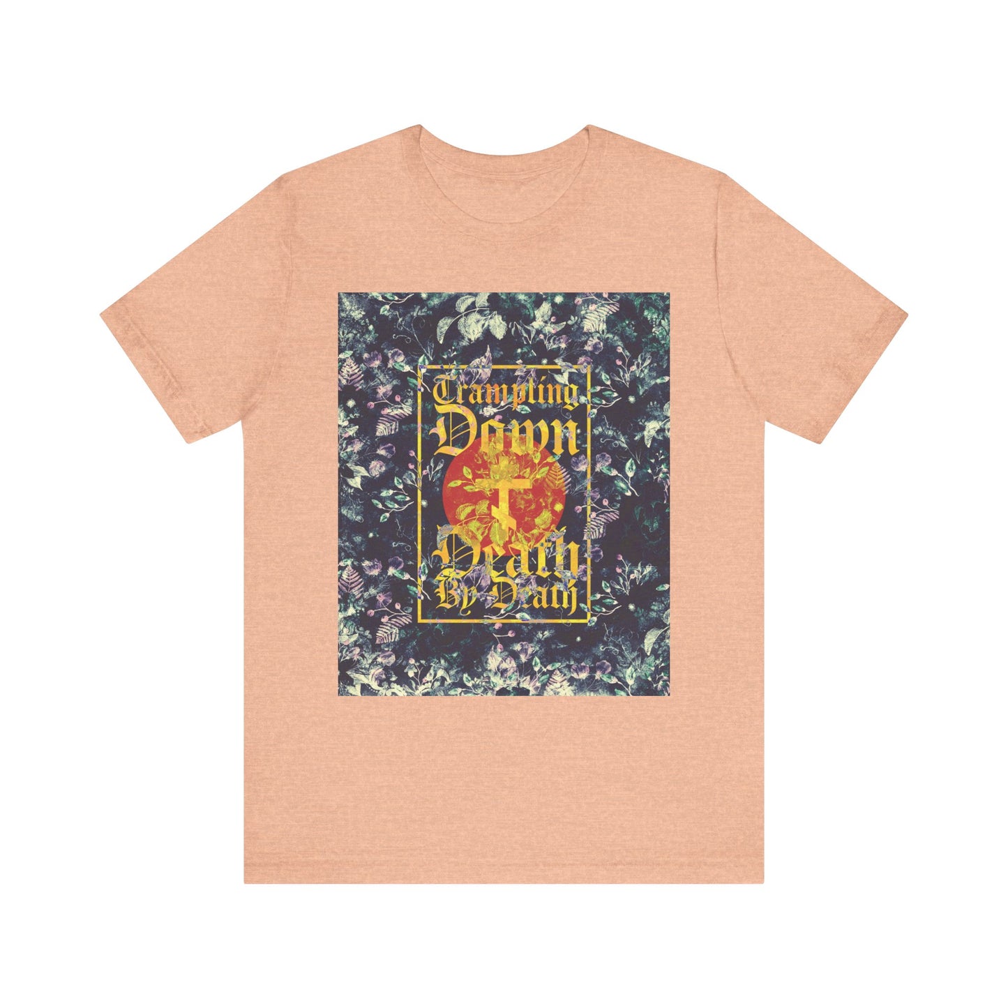 Heather peach unisex tee featuring a Paschal floral background, yellow Gothic script reading "Trampling Down Death By Death," and a three-bar cross—Orthodox-inspired design celebrating Christ as the ultimate Conqueror, inspired by the Akathist to Jesus.