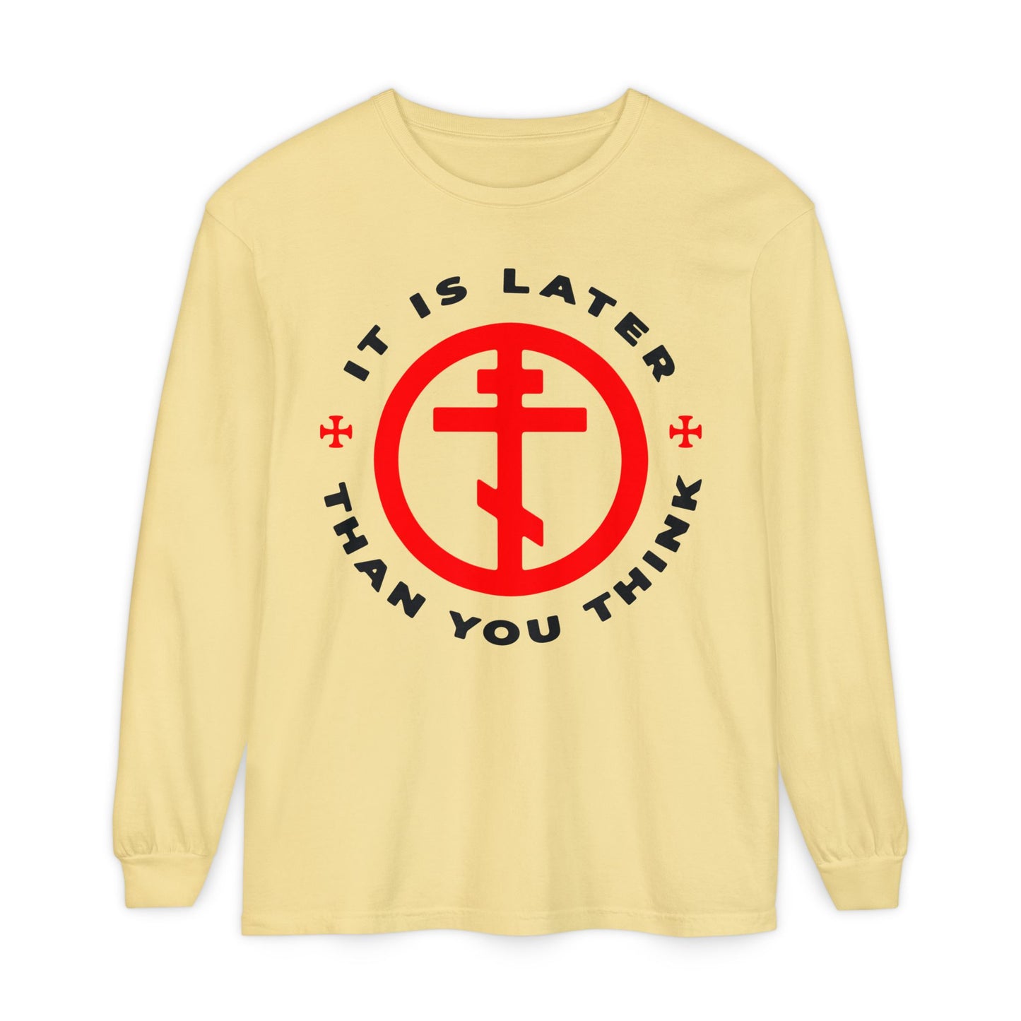 Butter-colored long-sleeve shirt featuring a red Orthodox cross in a circle and “IT IS LATER THAN YOU THINK” in black, inspired by Fr Seraphim Rose, Romans 13:10-12, and the call to put on the armour of light.