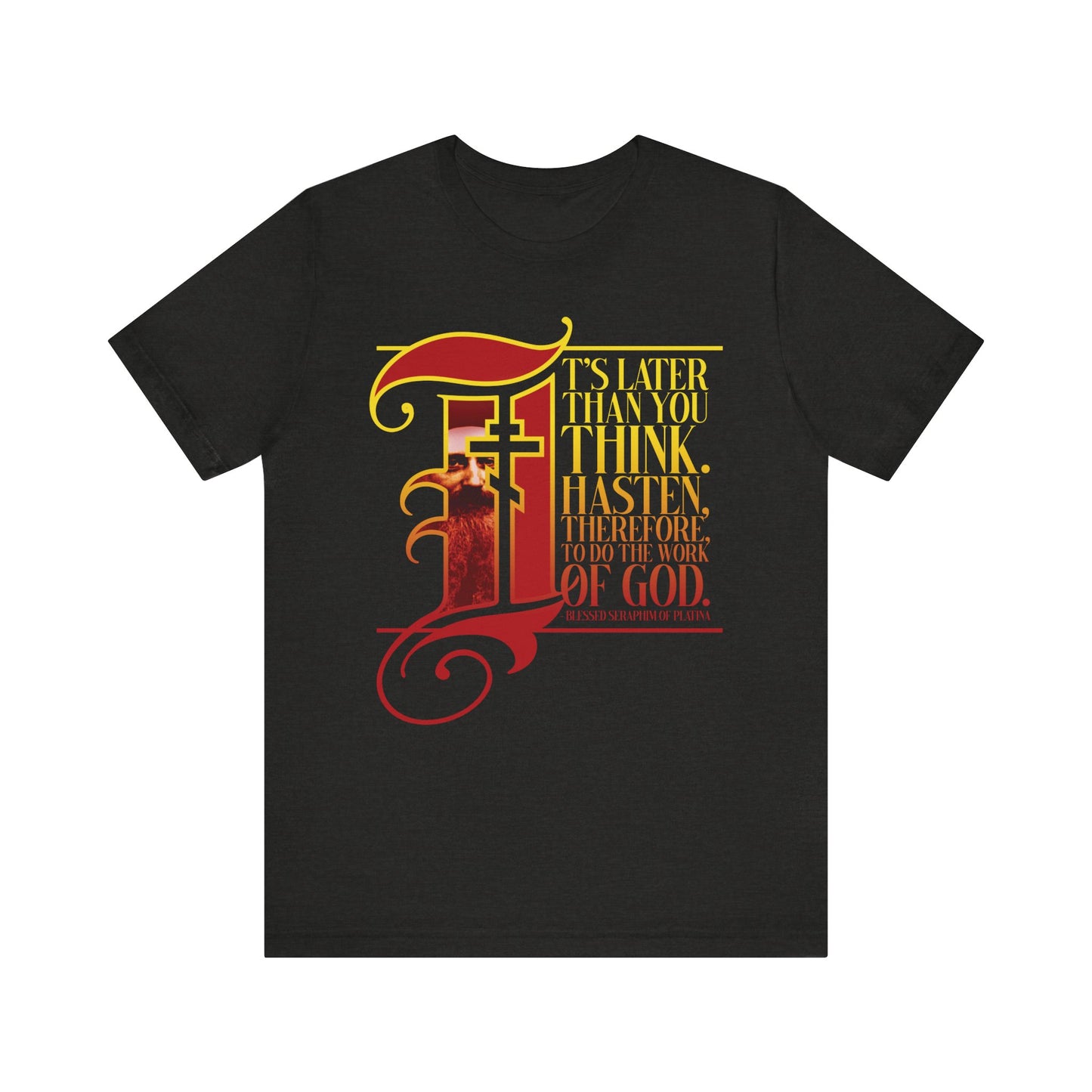 Black Heather tee featuring gothic-style illuminated manuscript drop cap lettering in gold and red: “It’s later than you think. Hasten, therefore, to do the work of God.”—a powerful reminder, inspired by St. Seraphim Rose and Orthodox Christian tradition, to follow Christ with urgency. Lightweight cotton unisex fit.
