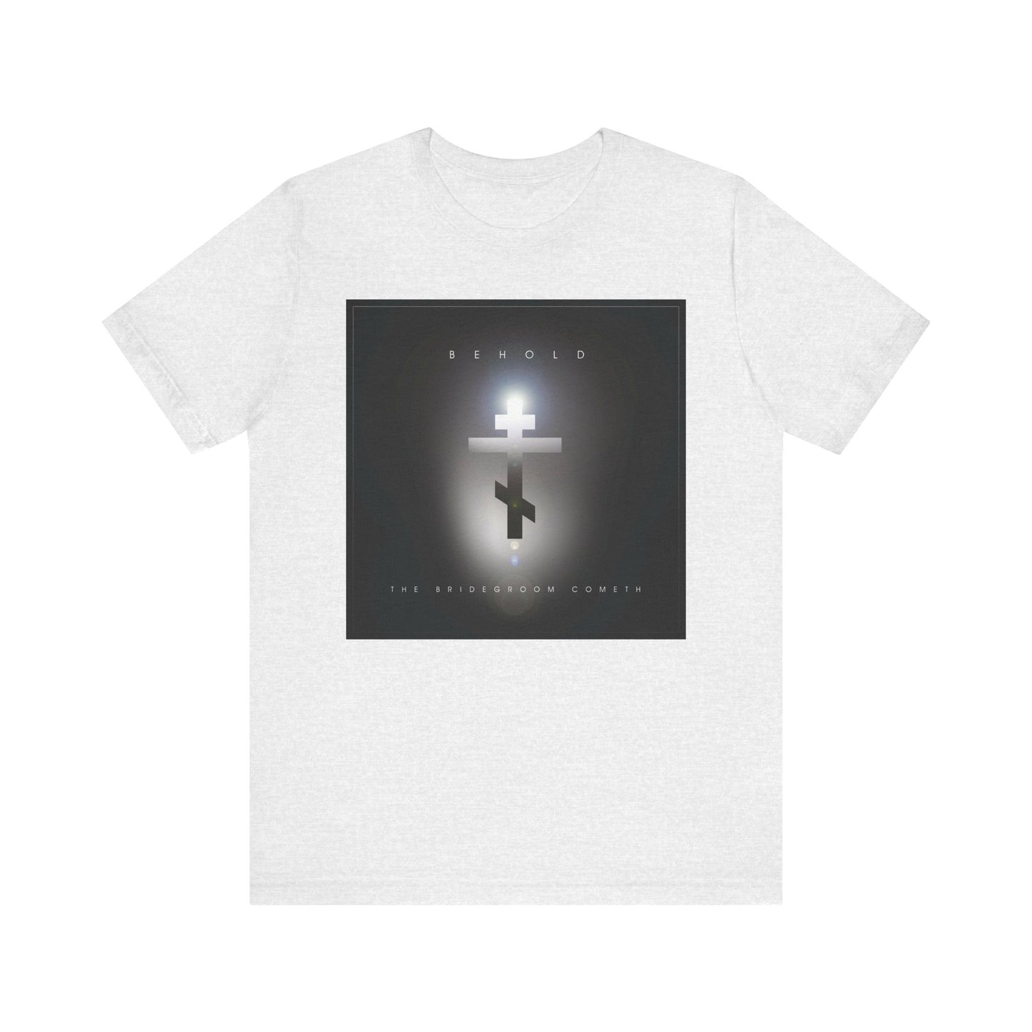 The ash-colored Behold the Bridegroom Minimalist Cinematic Lens Flare T-Shirt features a glowing Orthodox cross and BEHOLD THE BRIDEGROOM COMETH on the front—a reminder that the day of judgment may come unexpectedly.