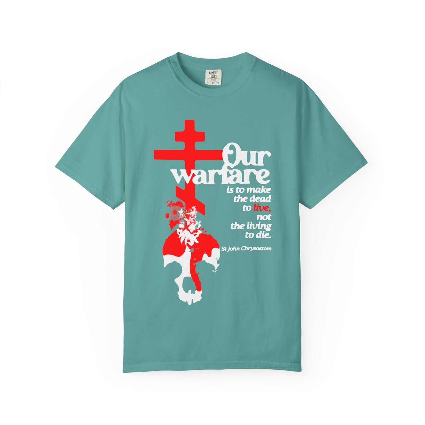 Seafoam heavyweight cotton unisex tee featuring an Orthodox cross, flowers, and skull design with a quote inspired by St. John Chrysostom’s teachings on Christian power—titled "Our Warfare is to Make the Dead Live.