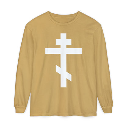 Tan long-sleeve shirt featuring a large white Orthodox cross on the front and the message: "May I never boast, except in the cross of our Lord Jesus Christ" (Gal 6:14). Inspired by Eastern Orthodox tradition.