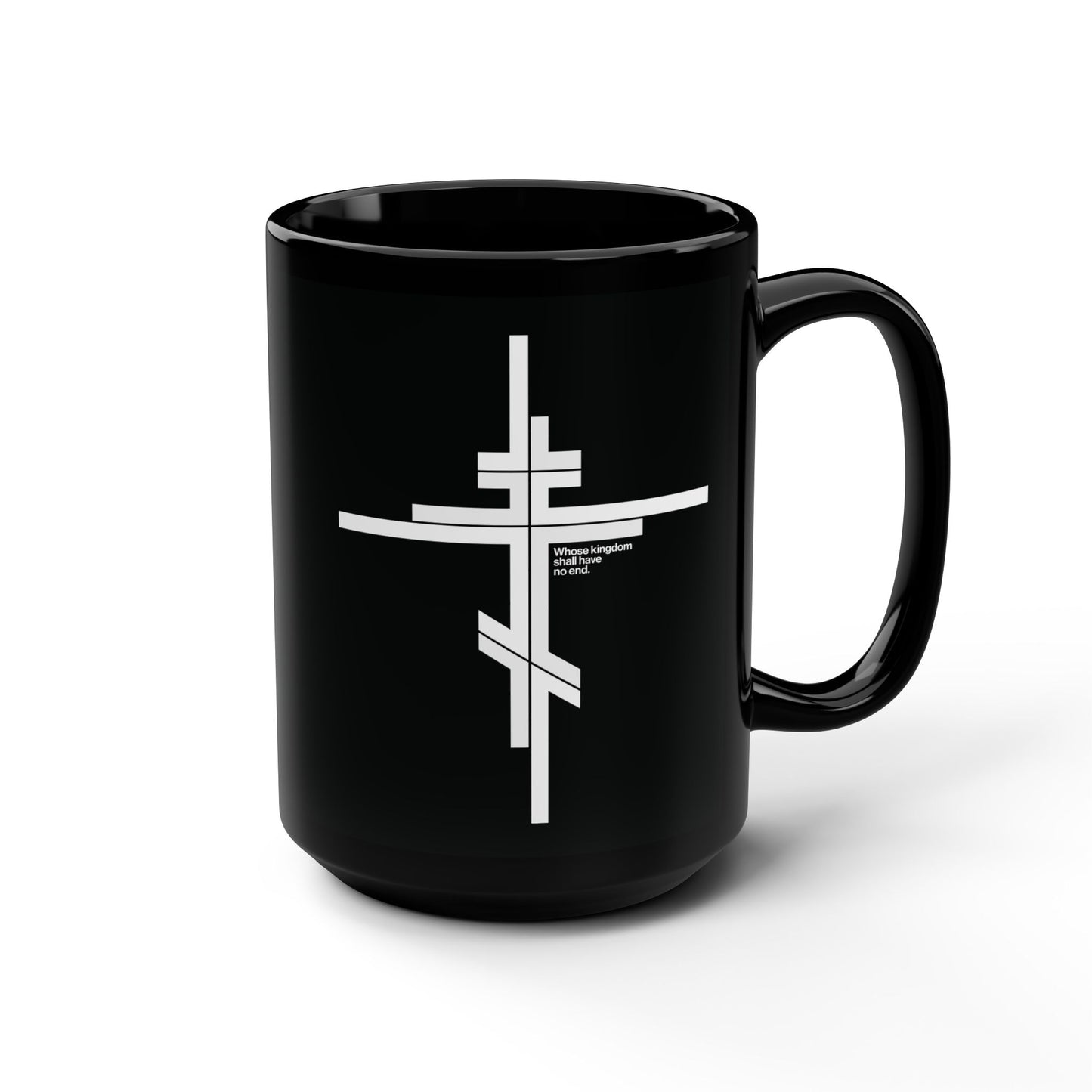 The "Whose Kingdom Shall Have No End" black mug features a modernist minimalist Orthodox cross and text, inspired by Luke 1:32-33, in a simple logo style. Photographed on a white background.