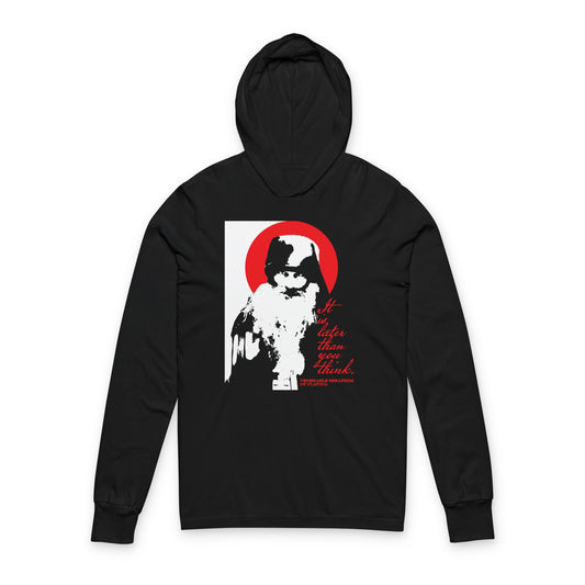 The Remembrance of Death "It's Later Than You Think" black hooded shirt features a high-contrast graphic of Fr Seraphim Rose with a red halo and bold text—modern Orthodox design inspired by memento mori themes.