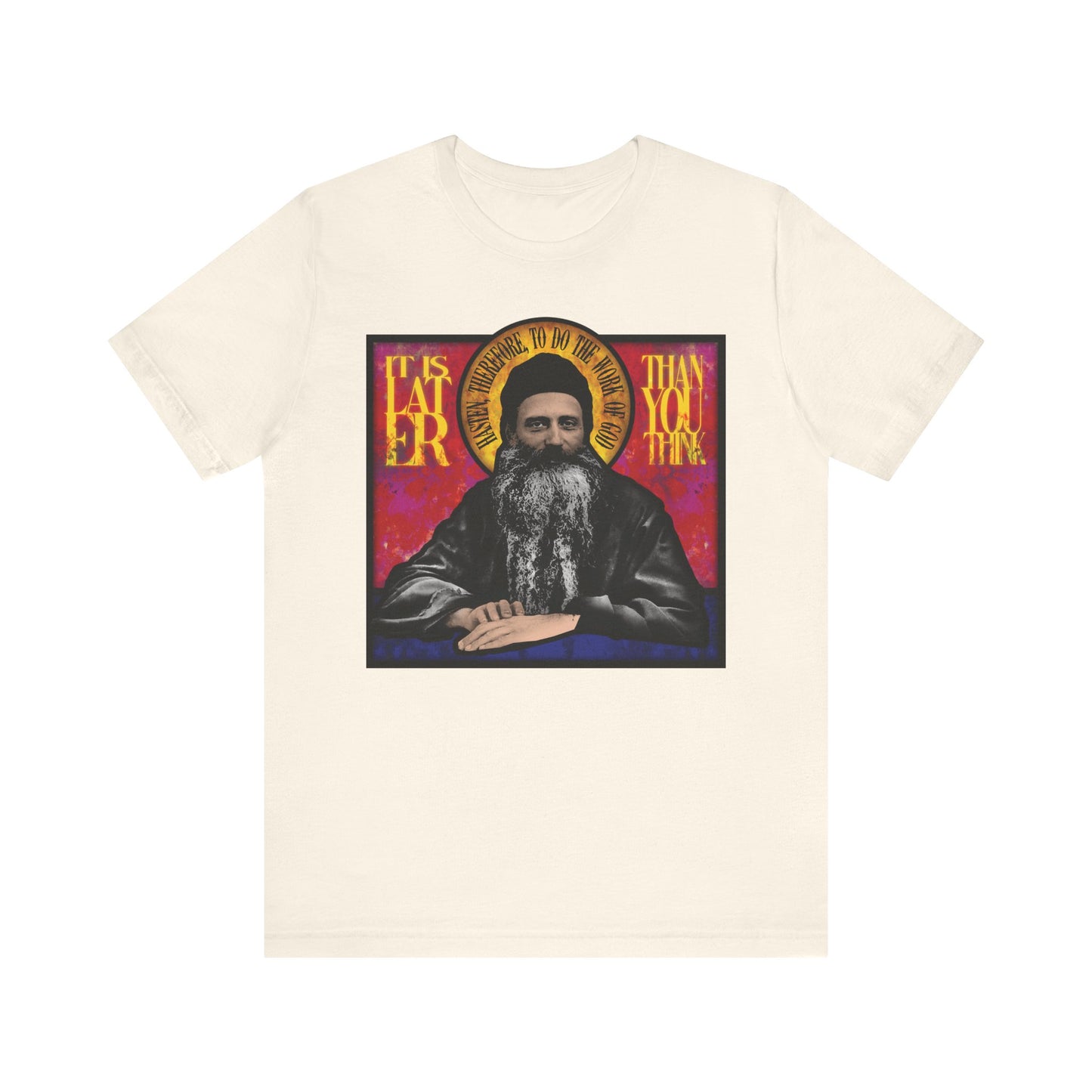 Natural-colored unisex t-shirt featuring Fr. Seraphim Rose in a stained glass design and the phrase "It Is Later Than You Think"—a lightweight cotton tribute to the American Orthodox monastic saint.