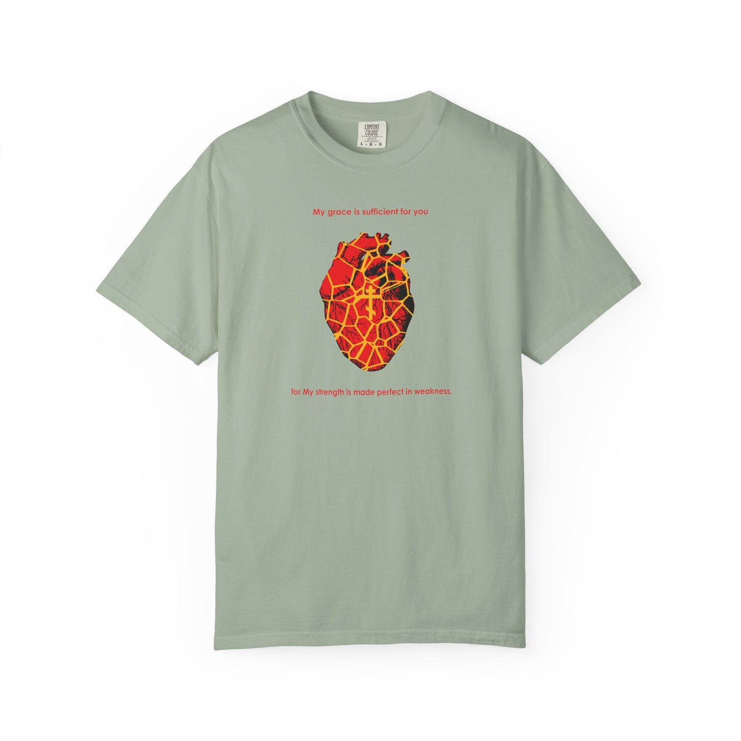 Bay heavyweight cotton unisex tee featuring a kintsugi-style golden broken heart with an Orthodox cross—symbolizing grace and resilience—with red text above and below the heart on the front, inspired by "My Strength is Made Perfect in Weakness" (2 Cor 12:9).