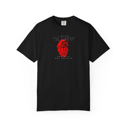 Black heavyweight cotton unisex tee, "A Heart That is Broken and Humbled God Will Not Despise," features a cracked red heart with Orthodox cross and Psalm 51-inspired text above and below the graphic on the front.