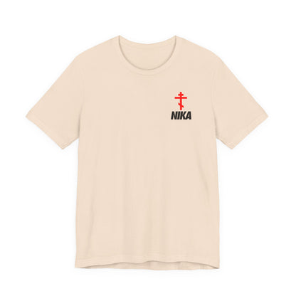 Soft cream t-shirt featuring an Orthodox cross with bold NIKA text in a small sporty design inspired by the NIKE logo; symbolizes "Jesus Christ Conquers"—a unique blend of athletic and ascetic Christian fashion.