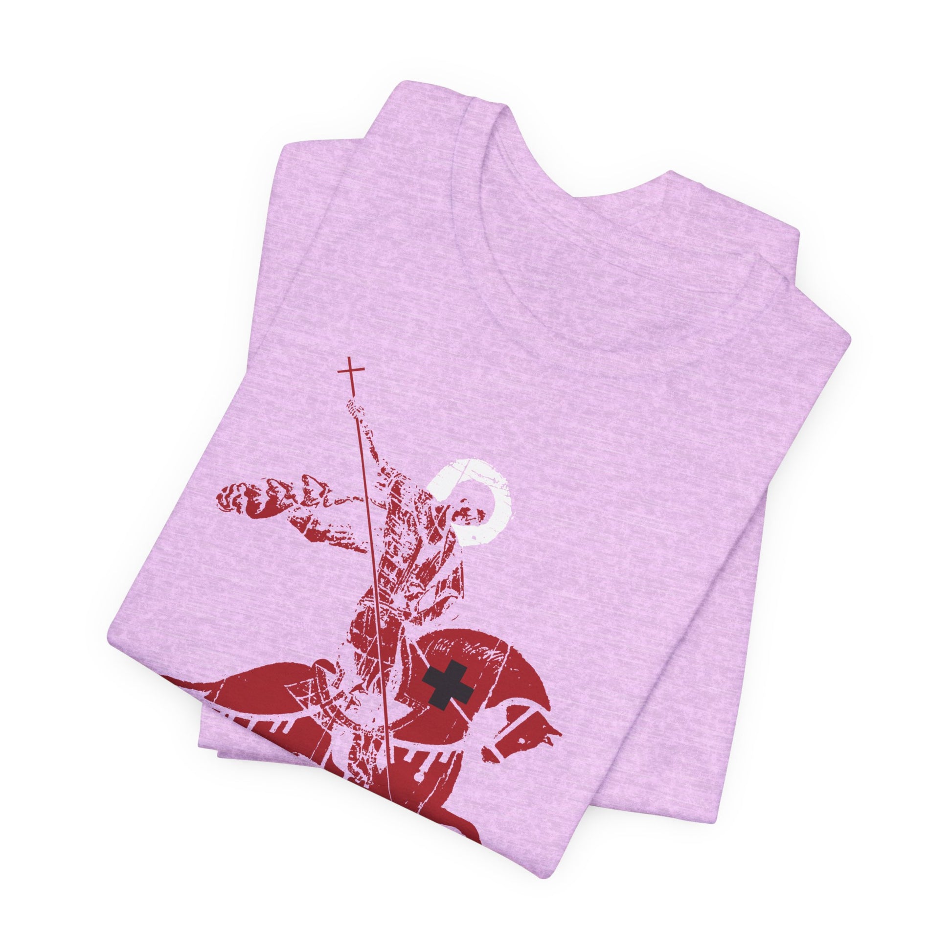 Two folded light purple Orthodox Christian lightweight cotton unisex tees, each featuring a bold red graphic of St George slaying the dragon and inspired by St John Climacus’s reflections on mourning over one’s sins.