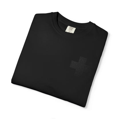 Folded Black On Black Simple Cross Embroidery heavy cotton tee, featuring a small, subtle cross on the chest.