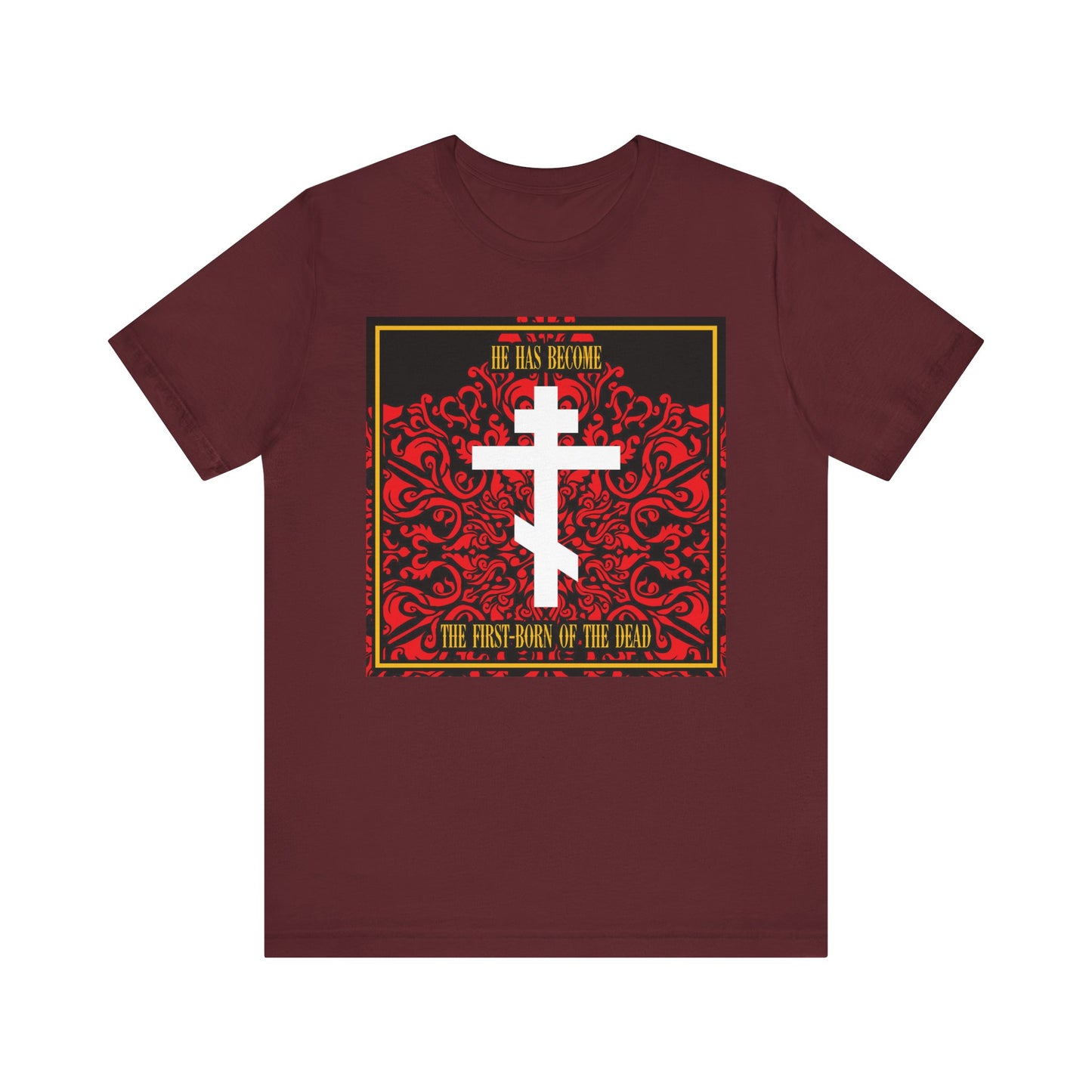 Maroon lightweight cotton unisex tee featuring a white Orthodox cross on red floral texture with the text: "He has become the first-born of the dead, a faithful witness—Jesus Christ.